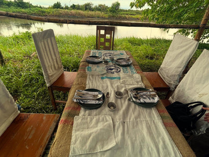 A table set beside a fishpond in Negros. Photo: @moyvortiz / Instagram.