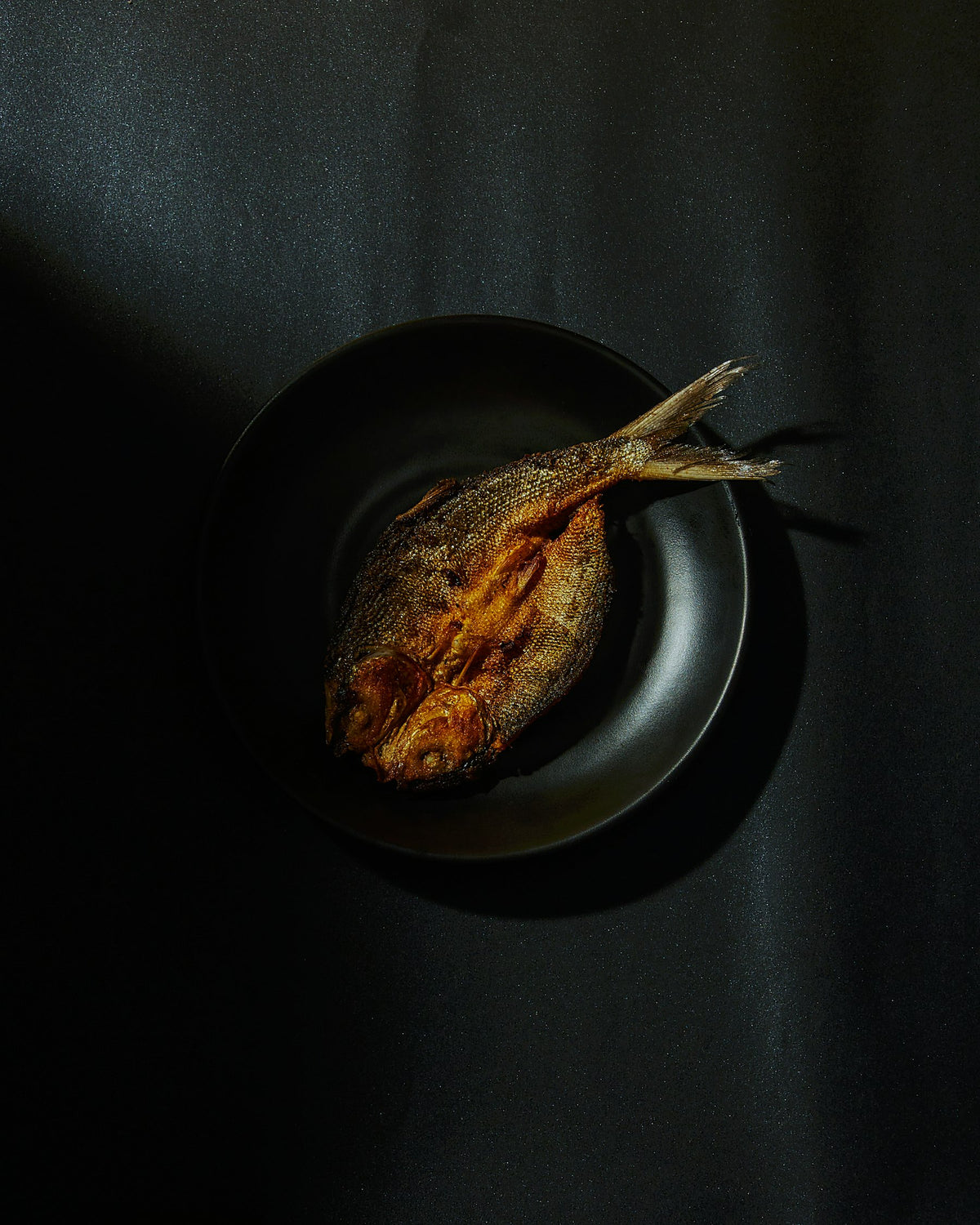 Close-up of daing na bangus prepared in Pampanga, Philippines. Photo: Jepsoy Sarmiento / Unsplash.