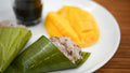 Rice-based breakfast with mango and banana. Photo: Christian Dala / Unsplash. Illustrative only; add-on food menu may differ.