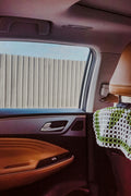 View through a car window from the passenger seat. Photo: N1CE / Unsplash. Illustrative image for shared transport add-on.