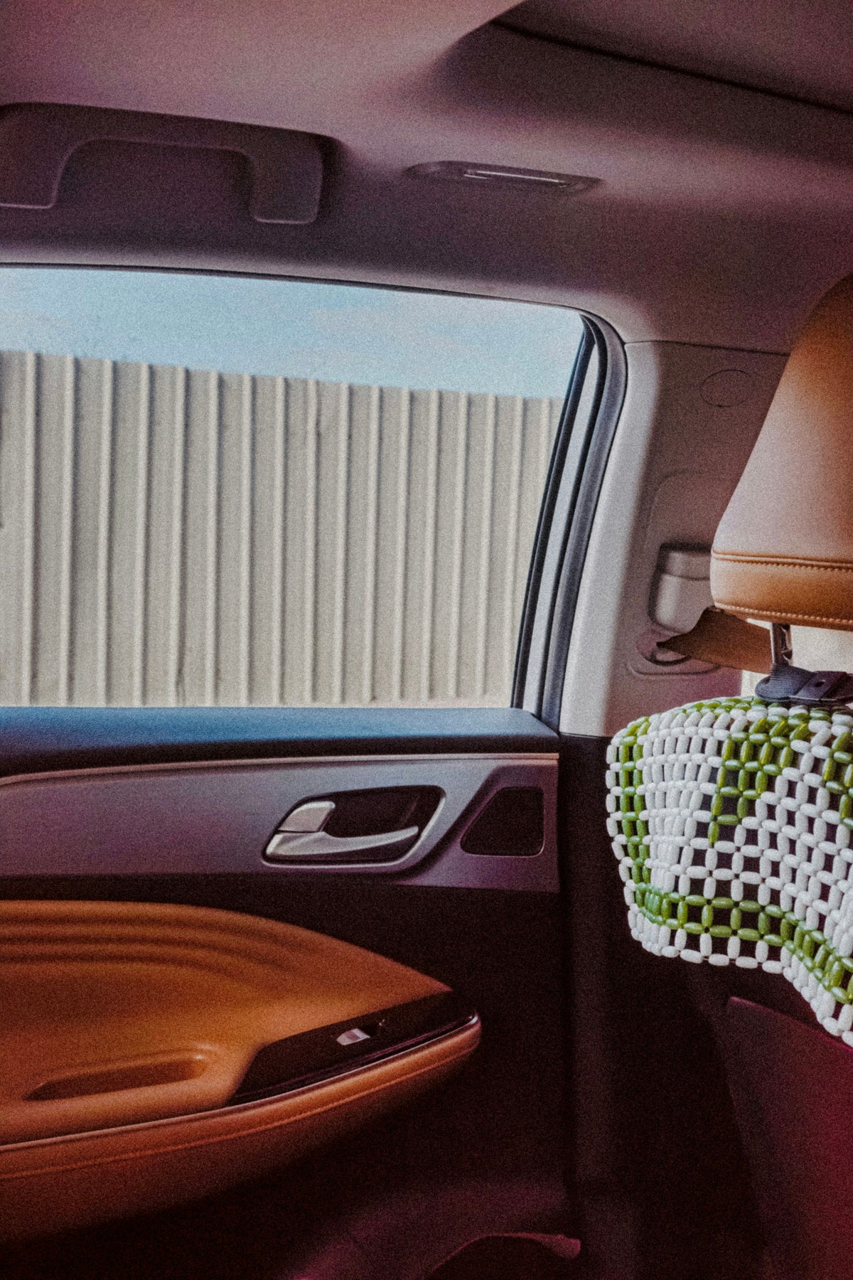 View through a car window from the passenger seat. Photo: N1CE / Unsplash. Illustrative image for shared transport add-on.