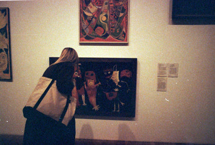 Woman looking at art in Tate Modern in London. Photo: Annie Spratt / Unsplash. Editorial illustration, not the local gallery.